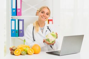 medium-shot-smiley-doctor-with-laptop-cauliflower_23-2148302072